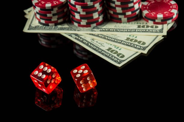 Close-up of Caribbean Stud Poker cards and betting chips at lapakcuan live table